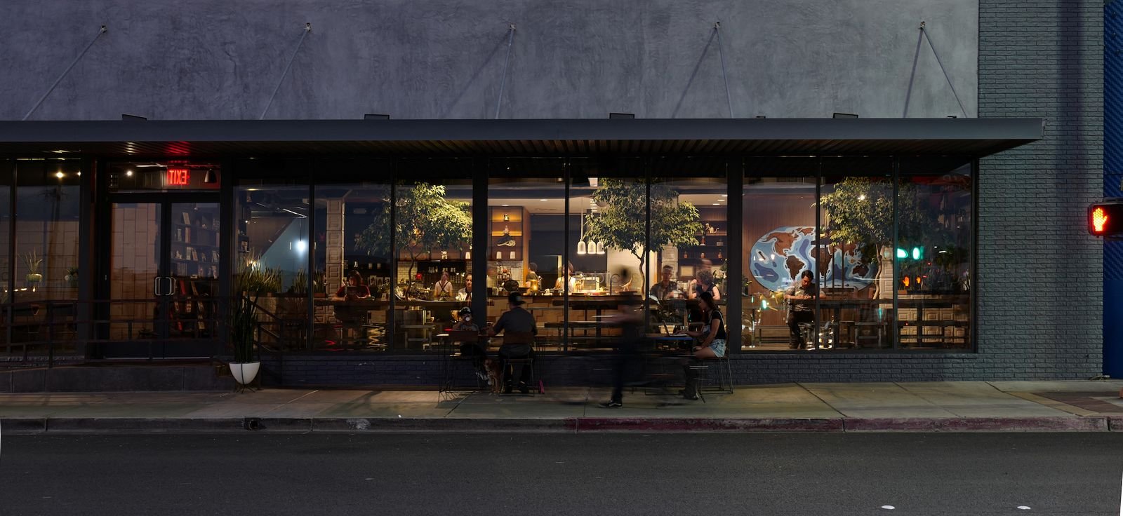 Image may contain Indoors Restaurant Cafe Cafeteria Urban Adult Person City Animal Canine Dog Mammal and Pet