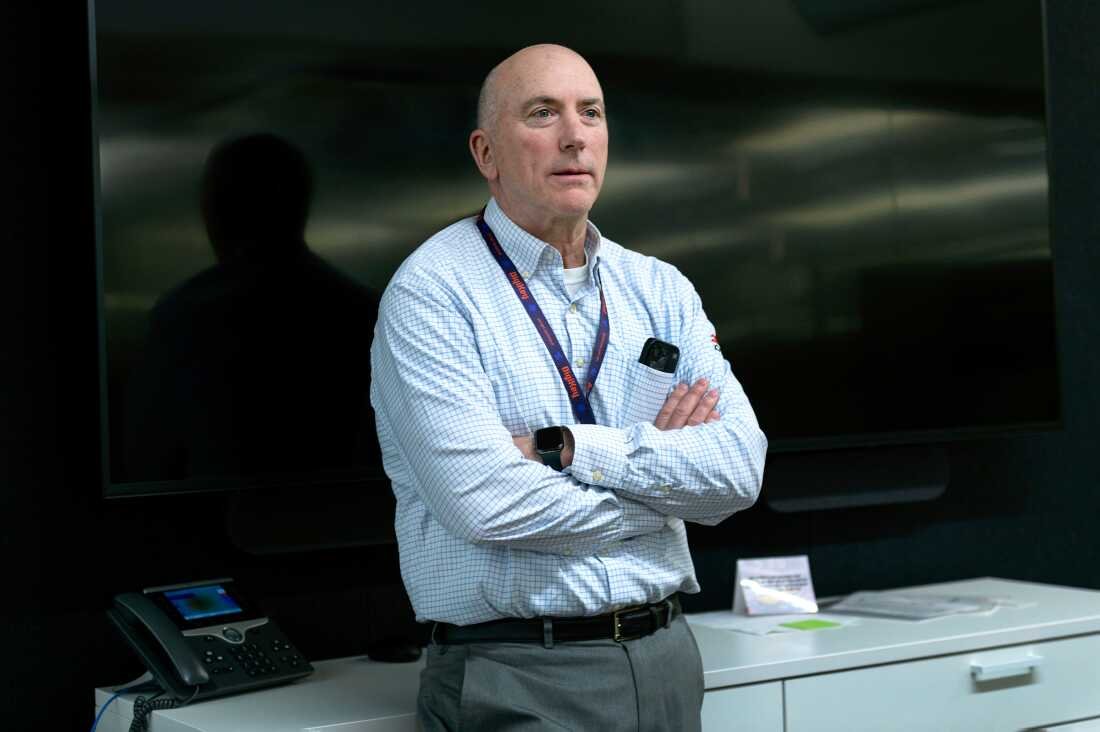 This photo shows Dave Doherty, president of DigiKey, at the company’s headquarters. Photographed from about the waist up, he