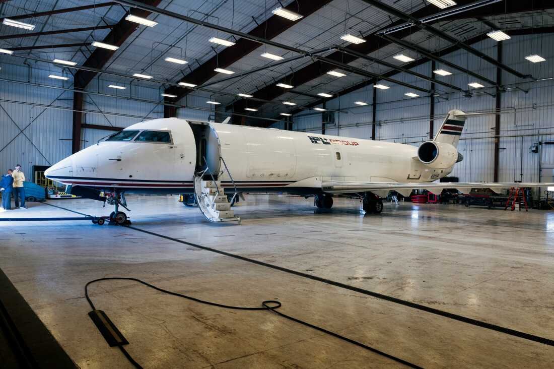 This photo shows a chartered cargo plane inside a hangar at the airport in Thief River Falls. The plane is white and has only one window along the side.